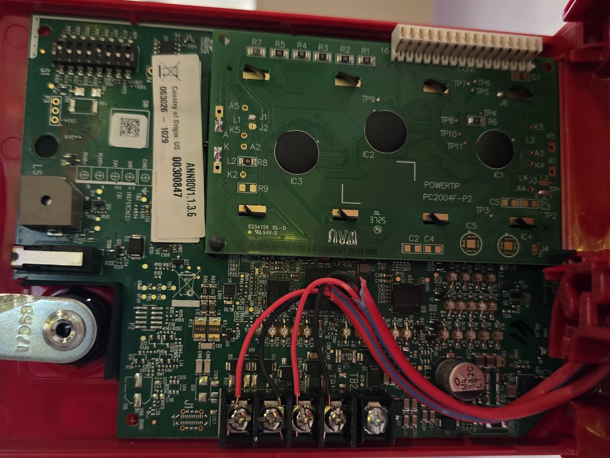 Remote annunciator circuit board with field wiring landed on its terminal block